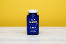 Load image into Gallery viewer, 92+ Sleep Support natural sleep aid capsules with melatonin and valerian root in blue bottle on wooden surface
